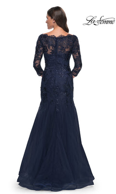 Back view of the Long Formal Dress: La Femme 30823, a floor-length navy blue modest lace mermaid dress with an off-the-shoulder neckline, three-quarter sleeves, and intricate sequin detailing on the bodice.