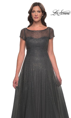 La Femme 30852: A woman wearing a charcoal gray, short-sleeve sparkly formal dress with an illusion neckline and all-over beaded embellishments.