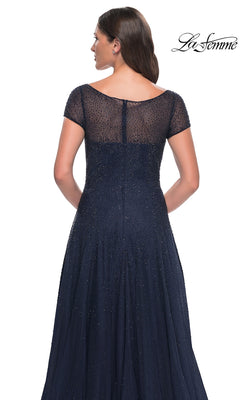 Back view of the Long Formal Dress: La Femme 30852, a navy blue, rhinestone floor-length formal dress featuring a sheer embellished bodice and short sleeves.