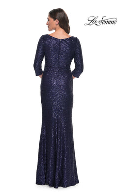 A woman viewed from behind wearing a floor-length, navy sequin Long Formal Dress: La Femme 30879 with three-quarter length sleeves.