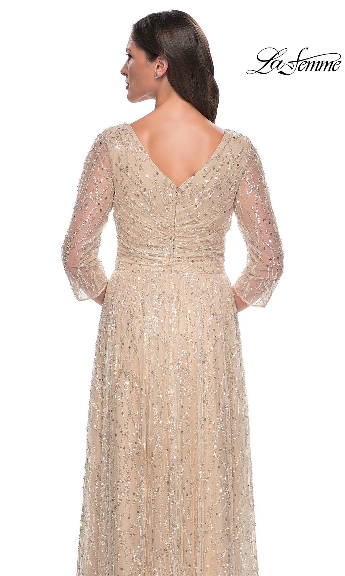 Back view of the Long Formal Dress: La Femme 30911, a floor-length, beige sequin evening gown with three-quarter sleeves and all-over silver beaded embellishments.