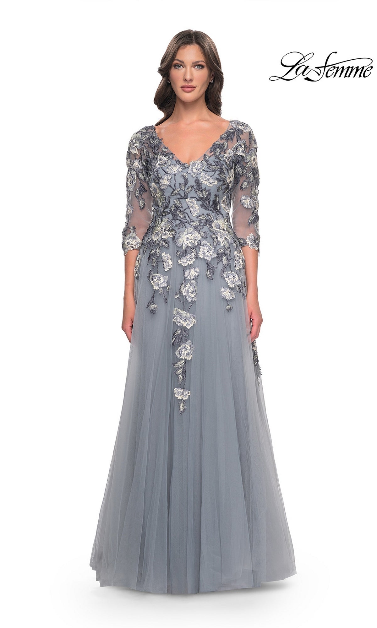 La Femme 30968 slate blue formal dress featuring a V-neckline, three-quarter length sleeves, and silver embroidered lace appliques on the bodice and skirt.