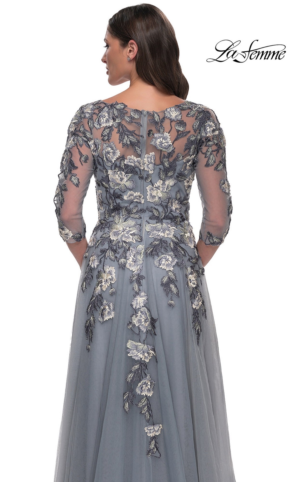 Back view of a slate blue floor-length La Femme 30968 formal dress featuring three-quarter sleeves and floral embroidered lace appliques.