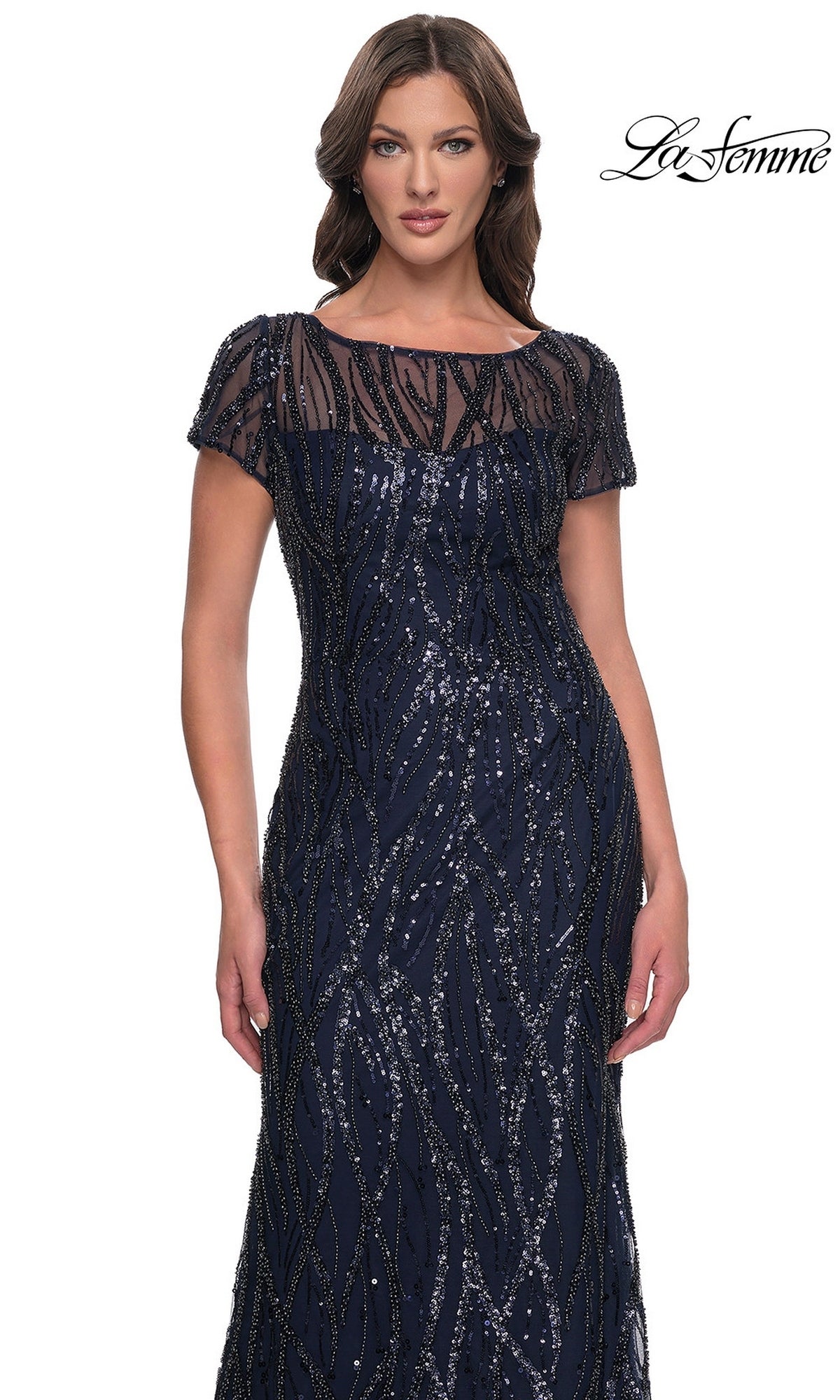 The La Femme 31005 long formal dress is navy blue, short-sleeved, and beaded, featuring a sheer neckline and vertical sequined patterns.