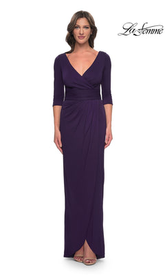 Woman wearing an aubergine long-sleeved modest formal dress, La Femme 31014, featuring a V-neckline and a faux wrap skirt.