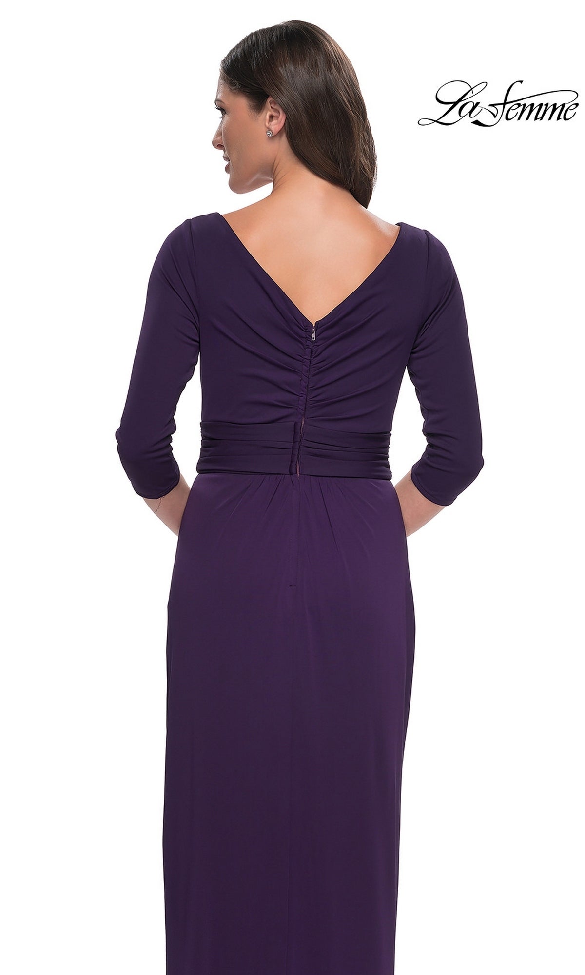 Back view of a woman wearing the Long Formal Dress: La Femme 31014, a dark purple modest formal dress with a V-neckline, three-quarter sleeves, and gathered back detail.