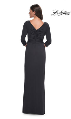 Back view of a woman in a Long Formal Dress: La Femme 31014, featuring a long jersey formal dress with three-quarter sleeves and gathered detail at the center back.