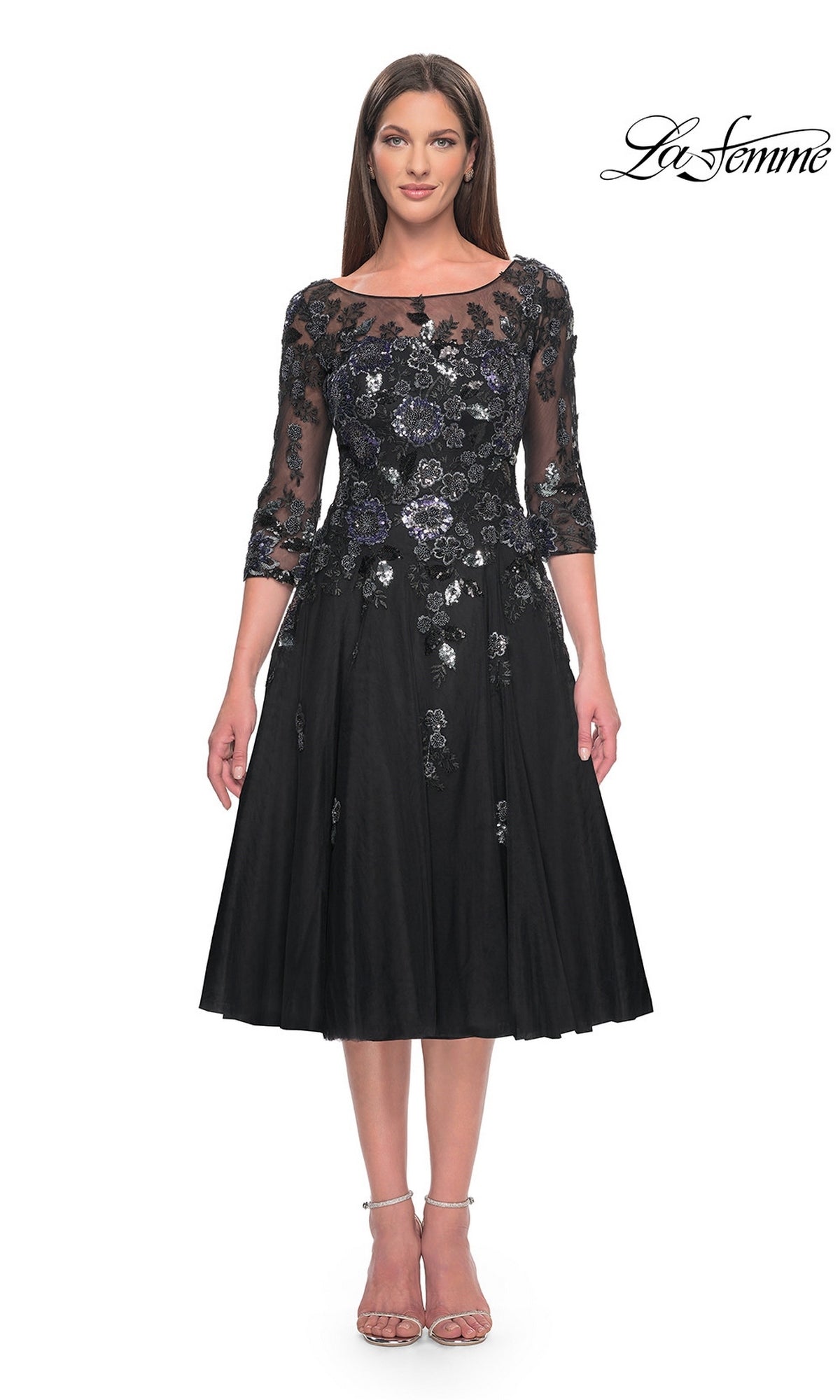 The La Femme 31017 midi wedding guest dress in black features three-quarter sleeves, a sheer neckline, and sequined floral appliques on the bodice over an A-line tulle skirt.