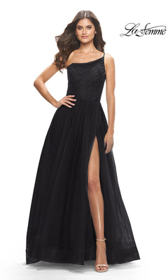 Woman poses with one hand on her hip in a striking black One-Shoulder Sheer-Bodice Prom Ball Gown 31069 by La Femme, featuring a thigh-high slit. "La Femme" logo is shown in the top right corner.
