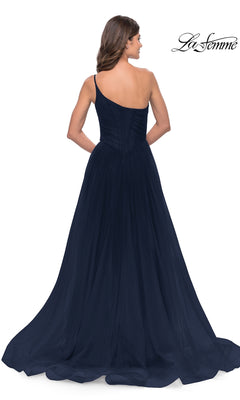 Woman in a navy One-Shoulder Sheer-Bodice Prom Ball Gown 31069, featuring a fitted bodice and flowing floor-length skirt, photographed from the back.