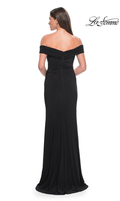 Back view of a woman wearing a La Femme 31086 floor-length, off-the-shoulder jersey formal dress with a high-leg slit.