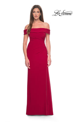 Red La Femme 31086 off-the-shoulder jersey formal dress with a draped neckline, side ruching, and a floor-length silhouette featuring a high-leg slit.