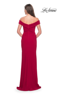 Back view of the Long Formal Dress: La Femme 31086, a floor-length red jersey gown with off-the-shoulder draped sleeves and a high-leg slit.
