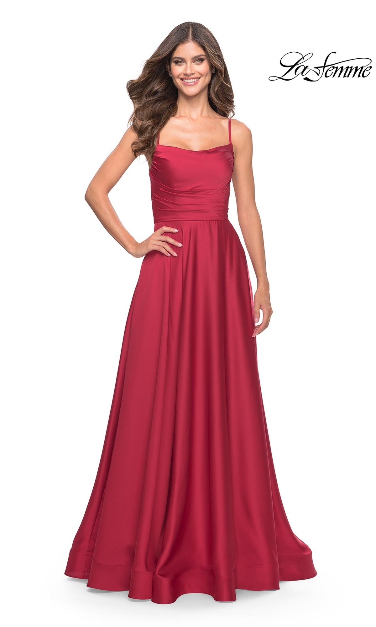 Smiling woman in a sleeveless, floor-length red satin Corset-Back La Femme Long A-Line Prom Dress 31105 with fitted bodice and thin straps. 
