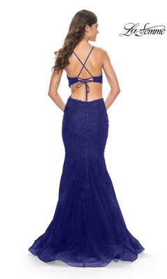 Back view of the Long Prom Dress: La Femme 31132, a sleeveless, royal blue floor-length gown featuring a lace-up corset back, a cutout waist, and an embroidered, mermaid tulle skirt.