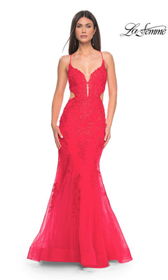 A woman wears the La Femme Long Lace Mermaid Prom Dress 31133 in bright red, featuring thin straps, cut-out sides, and a fitted silhouette. "La Femme" logo appears in the upper right corner.