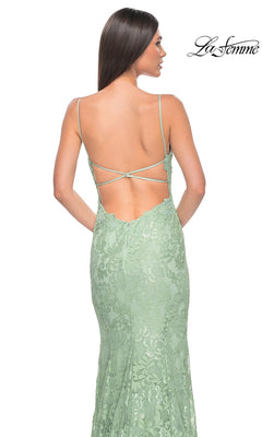 A woman, seen from behind, wears the La Femme Long Floral-Lace Prom Dress 31134 in light green with thin straps and an open back.