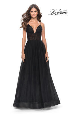 Woman in a sleeveless black Sheer-Waist La Femme Long Prom Ball Gown 31147 with deep V neckline and tulle skirt, standing against a plain white background.