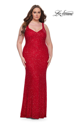 A woman models the La Femme Long Prom Dress 31163 in red, a sleeveless, floor-length plus-size sequin gown, standing against a white background with the La Femme logo visible in the corner.