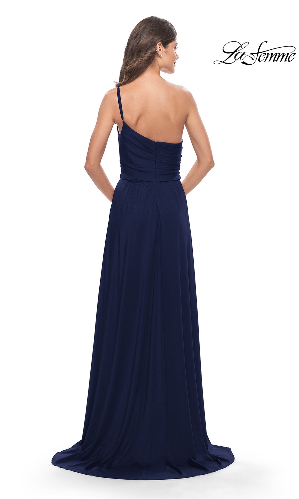 A woman models the One-Shoulder Long La Femme Formal Dress 31170 in dark blue, posing with her back to the camera against a white background. The 