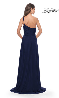 A woman models the One-Shoulder Long La Femme Formal Dress 31170 in dark blue, posing with her back to the camera against a white background. The "La Femme" logo appears in the top right corner.