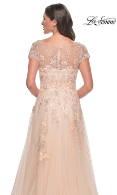 Back view of the Long Formal Dress: La Femme 31198, a floor-length champagne gown with a sheer cap-sleeve bodice and an A-line tulle skirt featuring floral lace embroidery.