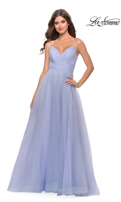 Woman models the La Femme A-Line Long Tulle Prom Dress 31204 in light purple, featuring spaghetti straps, a fitted bodice, and a flowing full-length skirt on a white background.