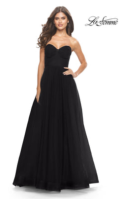 Woman in the Strapless Long Prom Ball Gown: La Femme 31205, featuring a fitted bodice and full A-line skirt, poses against a white background.