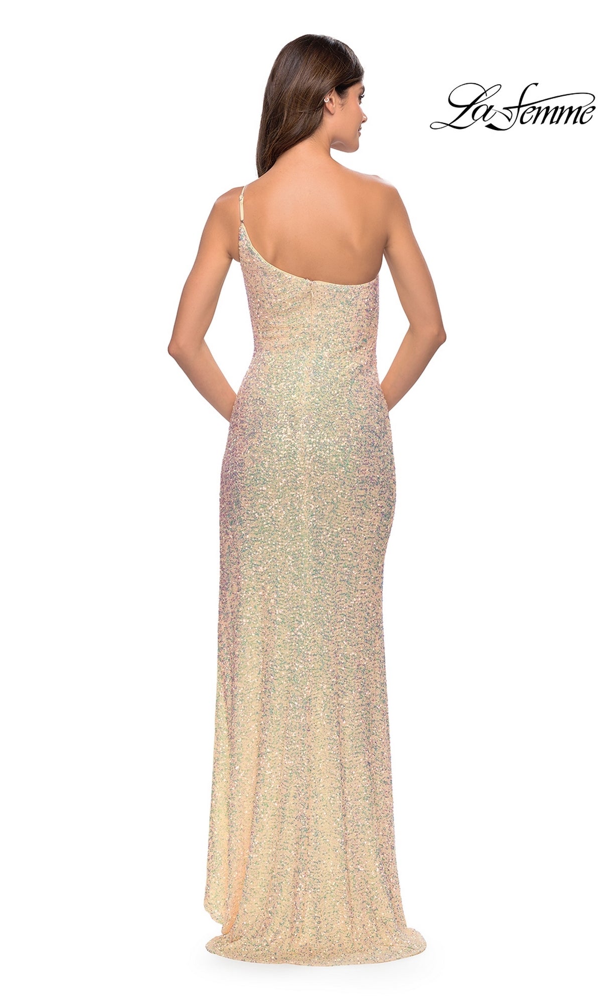 A woman stands facing away, hands at her sides, in the One-Shoulder La Femme Sequin Prom Dress 31212—a shimmery, floor-length gown with a fitted silhouette, sparkling sequins, and a subtle train.