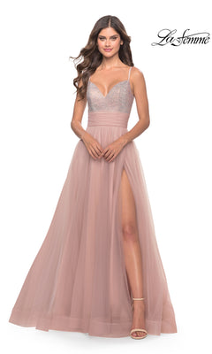 A woman wears the Beaded-Bodice Tulle Prom Ball Gown 31238, a sleeveless blush pink dress with a v-neck, beaded bodice, tulle skirt, and high slit, standing against a white background. "La Femme" is shown in the top right corner.