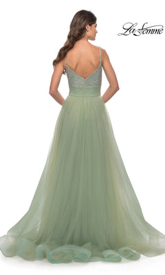 Woman in a light green, floor-length Beaded-Bodice Tulle Prom Ball Gown 31238 with thin straps, shown from the back against a white background. "La Femme" logo appears in the top right corner.