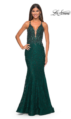 A woman poses against a white background in the La Femme Beaded-Lace Long Prom Dress 31265, featuring a sleeveless design, deep V-neckline, and fitted mermaid silhouette for an elegant prom look.