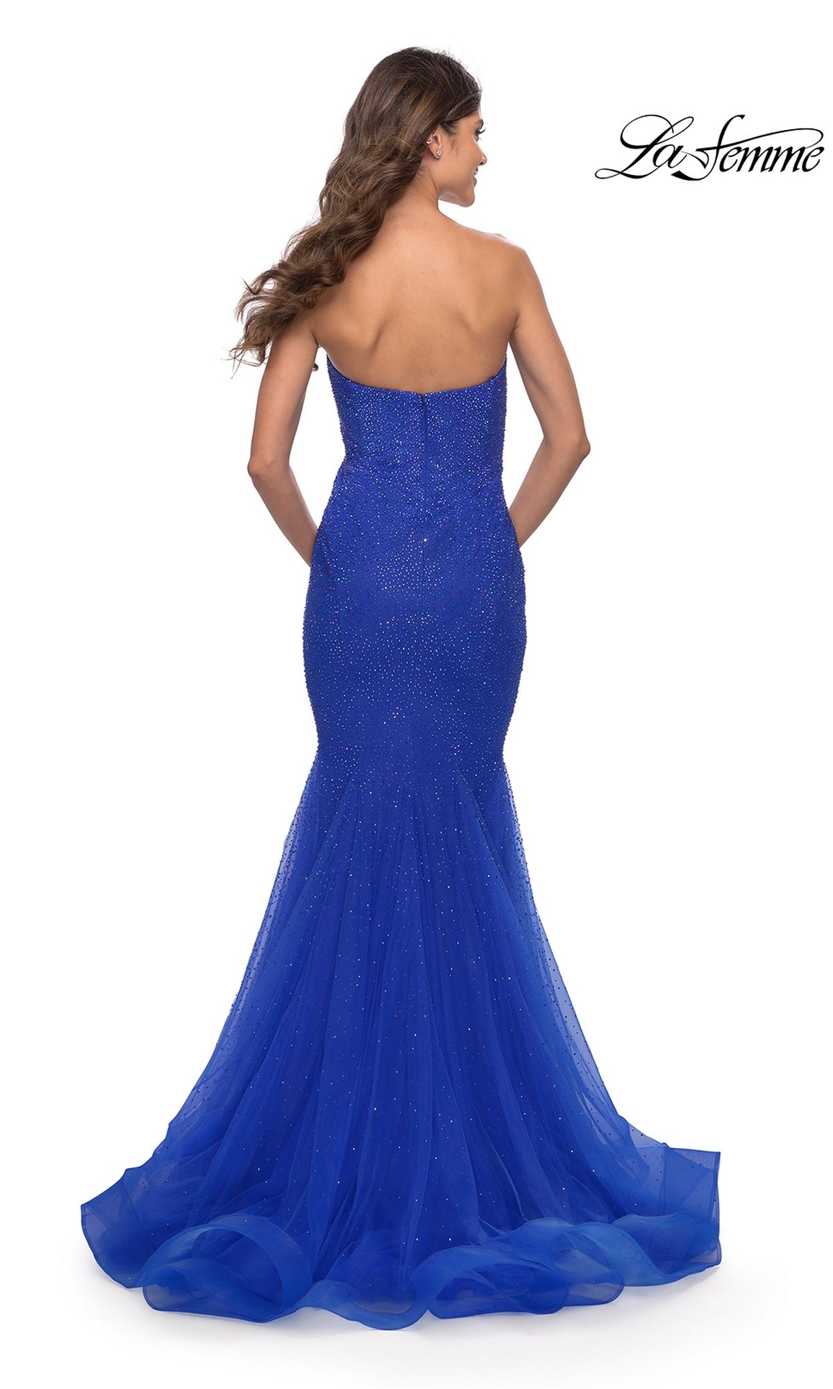 Back view of a Long Prom Dress: La Femme 31285, a strapless royal blue tulle mermaid gown with a floor-length flared skirt.