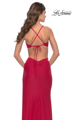Back view of the red floor-length jersey La Femme 31292 prom dress featuring side cutouts and a crisscross open back with thin straps.