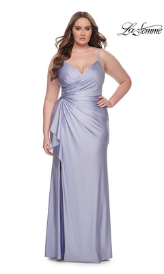 A woman stands against a white background wearing the La Femme Long Prom Dress 31309, a light purple, floor-length gown with thin straps and ruched detailing.