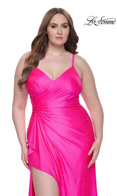 A woman wears the La Femme Long Prom Dress 31309—a bright pink, sleeveless gown with rhinestone accents and a high slit—standing against a white background. The "La Femme" logo appears in the top right corner.