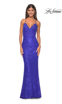 A woman wears the La Femme Long Beaded Lace Prom Dress 31359 in royal blue, featuring a fitted, sleeveless design with thin straps and a slight mermaid silhouette. The La Femme logo is shown in the top right corner.