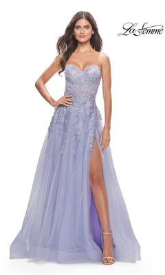 A woman stands confidently with one hand on her hip, wearing the La Femme Strapless Sweetheart Long Prom Dress 31363 in lavender, featuring floral embroidery and a high leg slit.