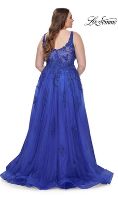 Shown from the back, the La Femme Long Prom Dress 31383 is a royal blue plus-size gown with sleeveless embroidered lace, a sheer beaded bodice, and a flowing floor-length skirt.