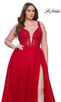 A woman models the La Femme Long Prom Dress 31394 with an embroidered lace bodice, plunging neckline, and high slit, standing against a plain white background with the "La Femme" logo.
