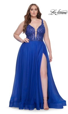 A woman wears the La Femme Long Prom Dress 31394, a royal blue sleeveless gown with an embroidered lace bodice, deep V neckline, and thigh-high slit. She stands against a white background with the "La Femme" logo in the top right corner.