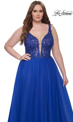 A woman in the La Femme Long Prom Dress 31394—royal blue with a deep V-neckline and embroidered lace bodice—stands before a white background. The La Femme logo appears in the top right corner.