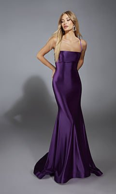 Wearing the Lace-Up Open-Back Long Prom Dress: Aerie Couture 313, a woman poses against a gray backdrop in a fitted, floor-length purple satin gown with thin straps and an elegant open-back design.