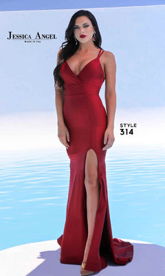 Woman in an Empire-Waist Long Prom Dress, Jessica Angel 314, fitted and sleeveless with a thigh-high slit, stands before a blue background.