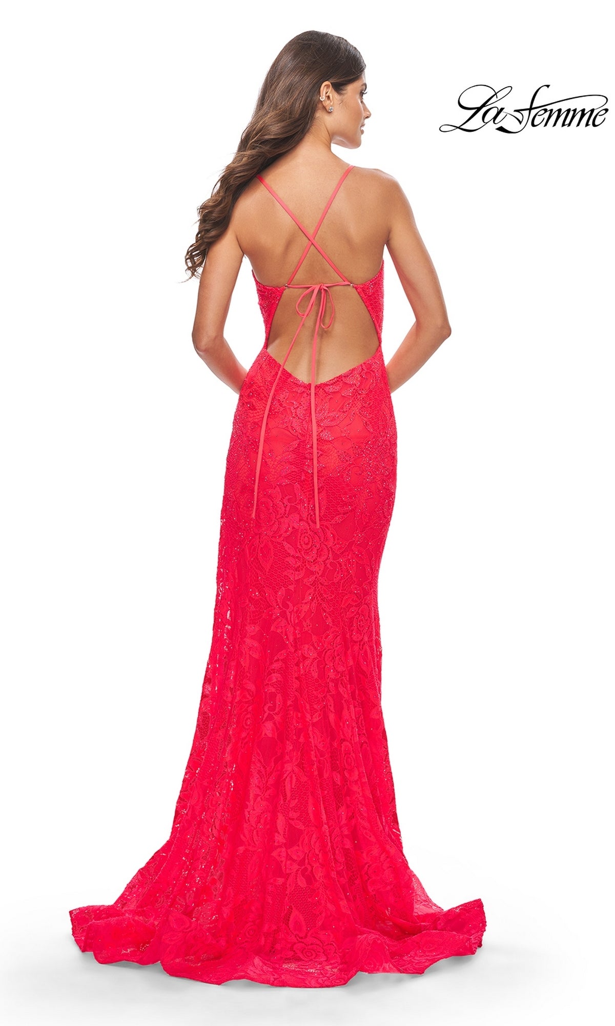 Woman in a floor-length, fitted bright pink 