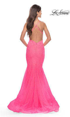 Back view of the Long Prom Dress: La Femme 31407, a hot pink, floor-length mermaid gown featuring a low back, spaghetti straps, and a crystal-embellished tulle skirt.