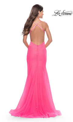 Back view of the Long Prom Dress: La Femme 31419, a fitted, hot pink, floor-length gown featuring a low back, crisscross straps, and a flared hem.