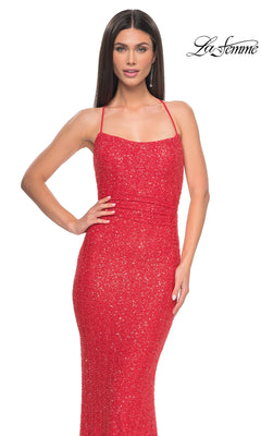 Woman wearing the La Femme Backless Long Sequin Prom Dress 31429 with thin straps, standing against a plain white background. The "La Femme" logo appears in the top right corner.