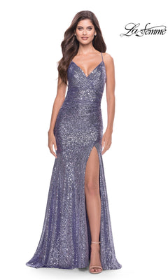 A woman models the Long Mermaid Sequin Prom Dress: La Femme 31431, featuring sparkly lavender sequins, a sleeveless design with spaghetti straps, and a thigh-high slit, against a plain white background with the La Femme logo in the top right corner.