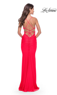 Back view of the Long Prom Dress: La Femme 31442, a floor-length red gown featuring a strappy open back and ruched detailing.